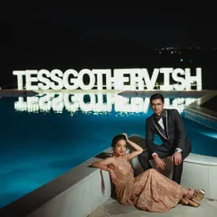 A dramatic, editorial-style shot by the pool. Tessa's reception look was designed to be memorable and photogenic from every angle.