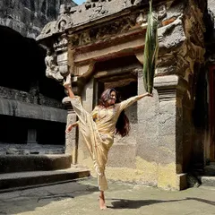 A flexible and dynamic pose at the Ellora Caves. These ancient sites are filled with artistic inspiration, and I can't help but feel the urge to dance and connect with their history.