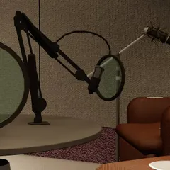 A close-up of the professional microphone setup, including pop filters and boom arms. I can source and install all the necessary equipment for a high-quality podcast studio.