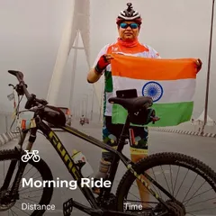 A cyclist with the Indian flag on the Signature Bridge. This picture captures the essence of our patriotic rides, combining national pride with iconic landmarks.