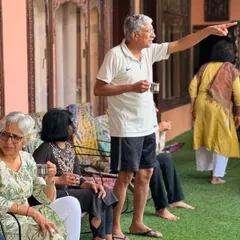 During a break at a retreat, participants relax and chat over a cup of tea. These informal moments of connection are where the bonds of our sangha, or community, are truly strengthened.
