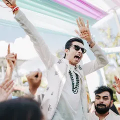The groom's pure excitement during his Haldi entry. We help create an atmosphere of celebration right from the start, with music and dance being a key part of every event.
