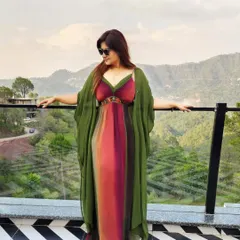The same maxi dress, layered with a mossy olive green kimono for an effortless, flowy flair against a beautiful mountain backdrop.