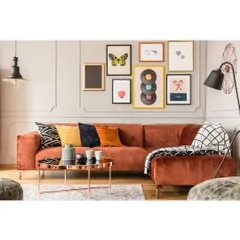 We love creating personalized spaces like this gallery wall. It's a great way to showcase art and memories, adding a unique and colorful touch to any room.