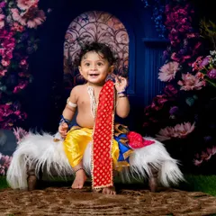 Cuteness overload with our little Krishna. The joy in his smile is absolutely infectious.