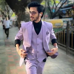 A modern and stylish look. Our lavender three-piece suit paired with a black turtleneck is a fresh and confident choice.
