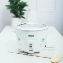 A lifestyle shot of an Usha rice cooker in a clean, bright kitchen setting. Placing the product in a realistic environment helps customers visualize it in their own homes.