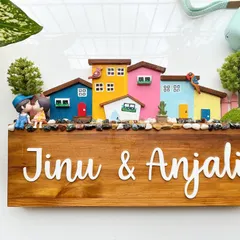 I love creating these vibrant cityscapes. This design features a row of colorful, hand-painted miniature houses on a stained wood base. It’s a playful and modern take on the family diorama, perfect for adding a splash of color to your entrance.
