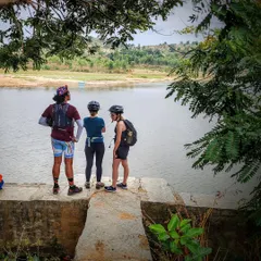 Riders enjoying a quiet moment together, looking out over the water. Our tours provide the perfect setting to connect with like-minded people.