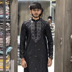 A model wearing the black ready-to-wear kurta. This is a versatile option for any festive evening event.