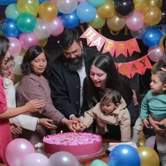 The big cake-cutting moment is always full of love. I focus on capturing the entire family coming together to celebrate, creating a memory that includes grandparents, parents, and the birthday star.