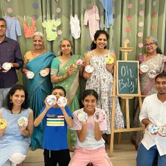 A heartwarming group photo from a baby shower. Our studio is a wonderful place for families to gather and celebrate milestones together.