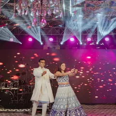 The happy couple takes the stage for their Sangeet performance. The dynamic lighting and massive LED screen backdrop were all part of our production to create a high-energy, concert-like experience.