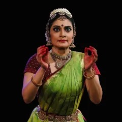 A direct and engaging gaze, inviting the audience into the narrative of the dance.