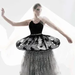 A full-length view of the swan-inspired draped creation. Using layers of sheer and embroidered fabric, I crafted a look that embodies the grace and mystery of a swan.