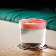 A layered drink featuring a vibrant pink foam. Creating stable, flavorful foams is a technique I teach to add texture and visual appeal to both cocktails and mocktails.