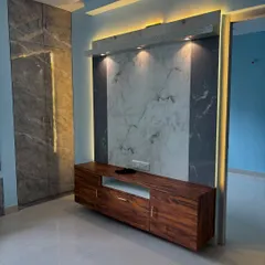 This is a modern entertainment hub I created, featuring a floating wooden console and a marble-finish backdrop. The integrated spotlights and ambient backlighting make it both a functional TV unit and a statement piece for the living room.