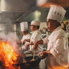Capturing the intense energy of a professional kitchen. This shot of the chefs at Yauatcha Mumbai shows the fire and precision that goes into creating world-class cuisine.