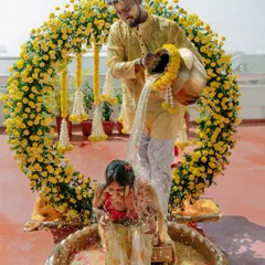 For your Haldi, we create vibrant, joyful settings like this circular marigold arch, perfect for capturing the fun and tradition of the ceremony.