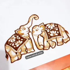 Another beautiful pair of decorated elephants. These can be placed facing each other on opposite hands for a symmetrical bridal look.