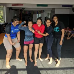 The women of Reign having a fun moment after a tough training session. We train hard, but we are also a close knit family.
