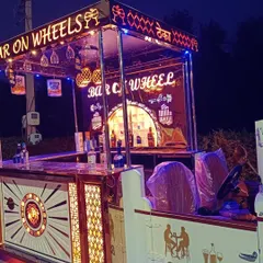 Our 'Bar on Wheels' fully stocked and ready for service. This setup is not just a novelty; it's a highly functional bar station that allows our mixologists to work efficiently and serve guests quickly.