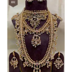 I believe in providing an "ekdum complete look," which is why most of my outfits come with jewellery. This is an example of a full bridal jewellery set available for rent, featuring multiple necklaces, earrings, and a maang tikka, all designed to complement a traditional bridal outfit.