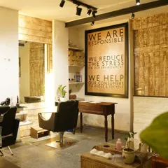 This corner of my salon reflects my commitment to conscious beauty. The natural wood textures and earthy tones create a warm, grounded space for your self-care journey.