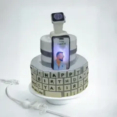 For the tech lover in your life, I create cakes that light up. This custom two-tier cake features an edible keyboard, a fondant Apple Watch, and an illuminated iPhone screen displaying a personal photo. It’s a unique design that’s guaranteed to be a conversation starter.