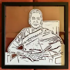 A beautiful portrait of a grandmother, perfectly preserved in a floating frame. This style of framing adds a modern and elegant touch to the hand-cut art.