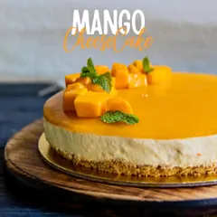 Our Mango Cheesecake is the perfect blend of creamy and fruity. A classic baked cheesecake base is topped with a smooth, vibrant mango puree glaze and fresh fruit.