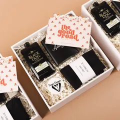 A sleek and stylish gift box for the groomsmen. This hamper includes a personalized hip flask with his name, a 'Team Groom' badge, and other essentials to thank your guys for standing by you.