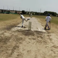 Action during one of our practice matches. We use a well-maintained turf wicket to give our players real match simulation, helping them adapt their bowling and batting techniques to actual game conditions. This is where skills are truly tested.