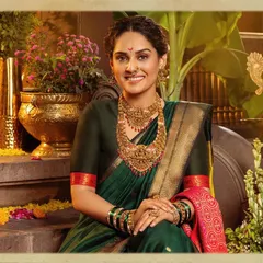 A portrait of timeless Maharashtrian elegance. This look, created for a Ranka Jewellers campaign, features a classic dark green saree paired with heavy, traditional gold jewelry, a delicate nath, and a radiant smile, embodying the 'सोनेरी सण' or golden festival spirit.