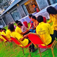Another view of our team in action. We ensure every guest, from the youngest to the eldest, gets a chance to have their mehndi done comfortably and professionally.