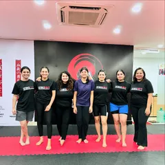 A candid moment with our female members. The smiles and camaraderie show the supportive and fun atmosphere that defines our women's training sessions.