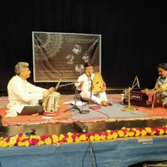 Another performance from the Gurupoornima stage, featuring vocal, tabla, and harmonium. The event is a celebration of all forms of Hindustani classical music.