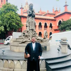 Outside the Madras High Court, where I handled a complex cheque bounce case valued at ₹2.45 Crores. We successfully argued for the case to be transferred to a different court to ensure a fair and impartial trial, free from potential bias. This victory set a valuable precedent for similar cases under the Negotiable Instruments Act.