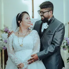 A beautiful portrait of the couple inside the church after the ceremony, their smiles reflecting the joy of their union.