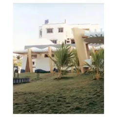 This view from 2002 shows the CC Office in its landscape, with a gazebo and rolling green lawn. The design prioritized the experience of walking through the garden to reach the building, blending the journey with the architecture itself.