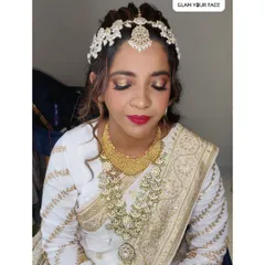 Another look at our ethereal bride Sarah for her Nikah. The soft gold eye makeup and classic red lip create a look that is both traditional and absolutely radiant.