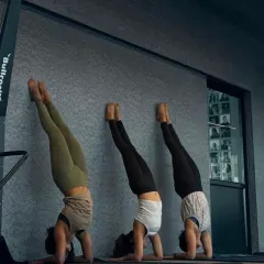 Working on headstand variations against the wall is a great way to build endurance and play with different leg positions safely. This was part of our advanced Saturday workshop.
