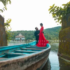 My rental gown looks just as stunning in a serene waterside setting. The bold color creates a beautiful contrast with the natural landscape, perfect for a memorable photoshoot.