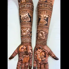 This narrative mehandi honors family by featuring portraits of the bride's parents on one palm, while the other shows the couple during their varmala ceremony.