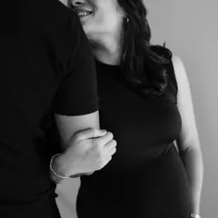 A beautiful black and white close-up of the couple indoors. Her upward gaze and his loving look create a sweet and romantic portrait.