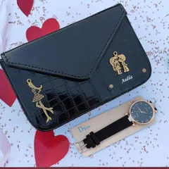 This elegant black version of the sling bag and watch combo is perfect for any occasion. The bag is personalized with a name and two beautiful charms.