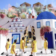 From a burst of colors in Greece to time travel in Paris. This 'Around the World' carnival entry was a dream, telling the couple's story through different themed zones.