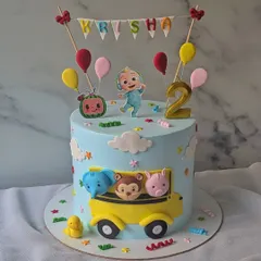 The wheels on the bus go round and round! This Cocomelon cake is perfect for a second birthday, featuring JJ, the iconic yellow school bus, and animal friends.