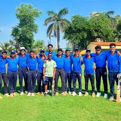 The team stands together for a photo on the lush green outfield, celebrating their promotion to the 'A' Division in the Kanga Cricket League.