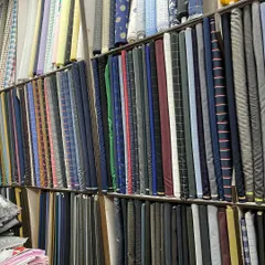 Another view of the fabric collection at H.K Tailors. The right color and pattern can define your look, and I have hundreds of options for you to choose from.